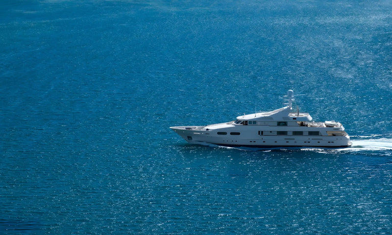 Yacht sailing on a calm blue ocean