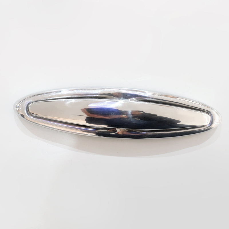 Silver metallic object on a white background