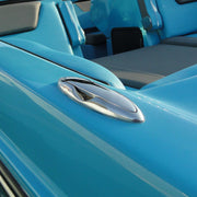 Close-up of a blue pontoon boat with a metallic emblem.