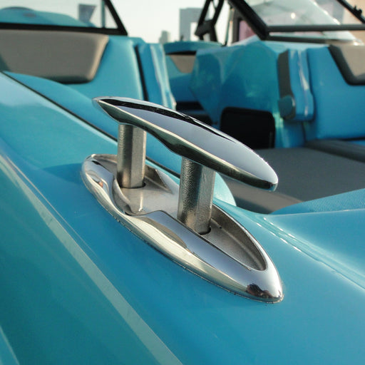 Close-up of a blue boat interior with a metallic cleat.