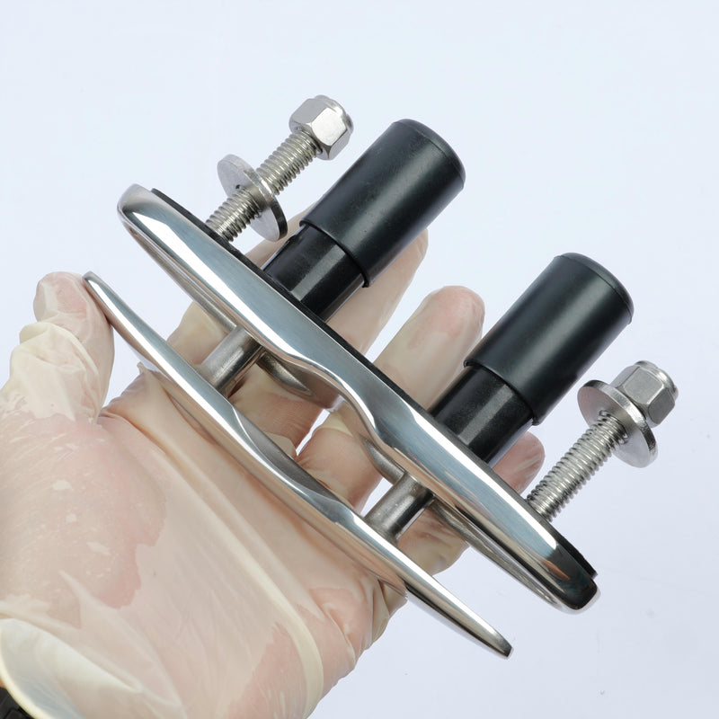 boat cleats held by a gloved hand